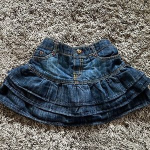 Adorable tiered skirt with pantries attached. Size 4T.